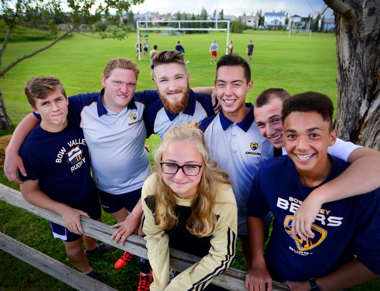 From left to right: Bow Valley Rugby Club players Oscar Holbrough, Branden Mangold, Brennan Bourchier, Austin Dixon, Rylen Waugh, Isaiah Springer, and AJ Mears pose at one of 