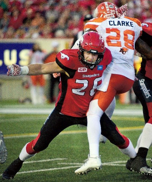 Cochranite and Calgary Stampeders running back Rob Cote (left) scored his first touchdown in a couple seasons as the Stamps beat the Lions 37-9 on Aug. 19.