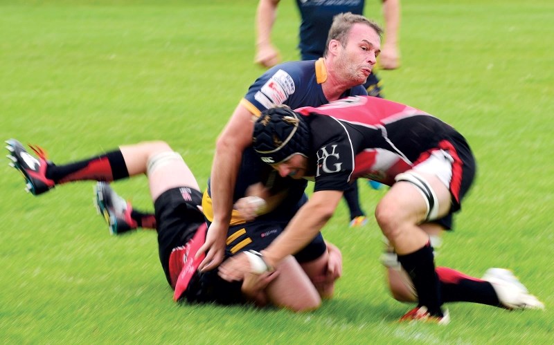 Martin Carew gets tackled to the ground as the Bow Valley Grizzlies smashed the Calgary Saints 80-0 at Mitford Pond on Aug. 27. The victory means the Grizz now sit second in