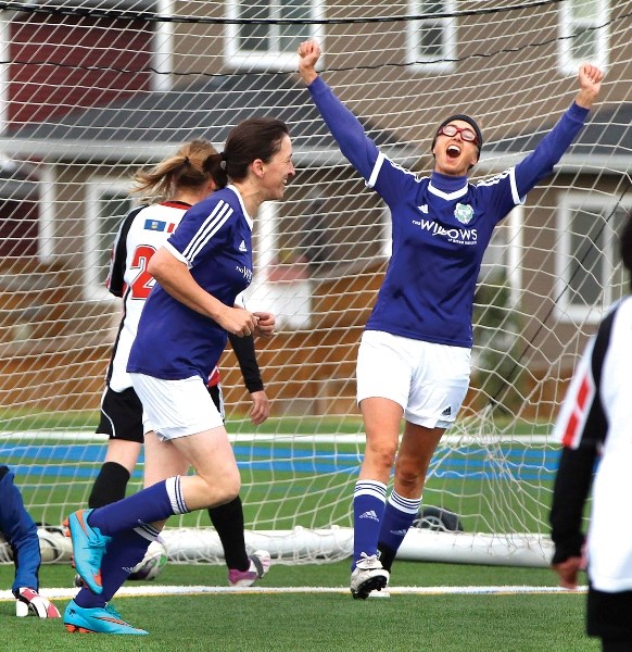 Lucy Lovelock (left) and Nicole Mason celebrate Mason&#8217;s goal during the Cochrane Soccer Club&#8217;s womens over-40 team&#8217;s 3-0 victory over the Chestermere United 