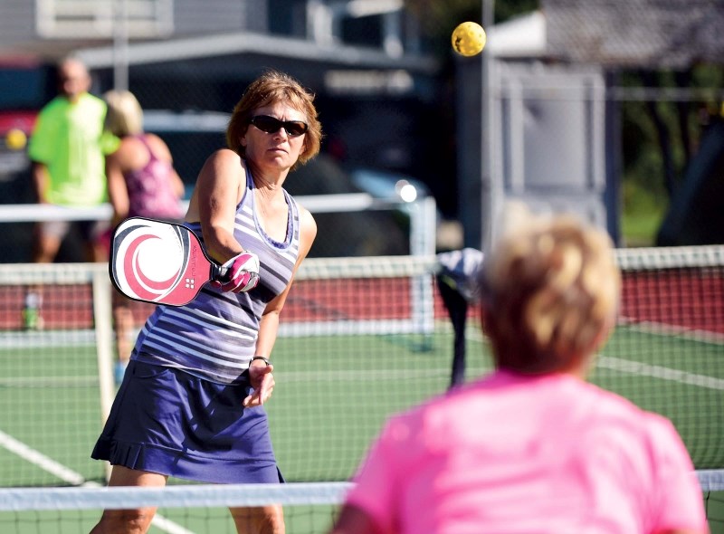 Janine Cote plays a game of pickleball on Aug. 30.