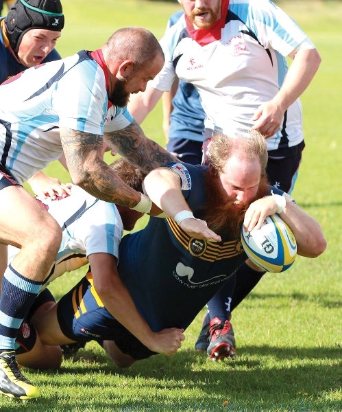 Samuel O&#8217;Keefe (with ball) and the Bow Valley Grizzlies booked their place in the Calgary Rugby Union Division Two playoffs with a 34-15 victory over the Calgary