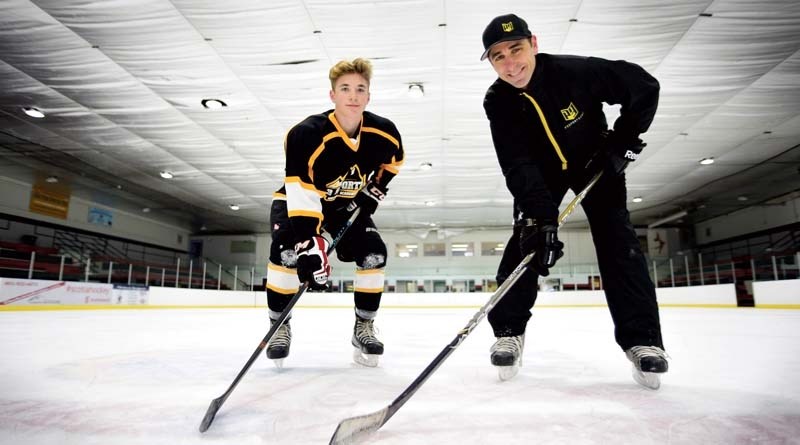 Right-winger Ethan Strang and P3 coach Ryan Hilderman after a Cochrane Hockey Academy practice at the Cochrane Arena.