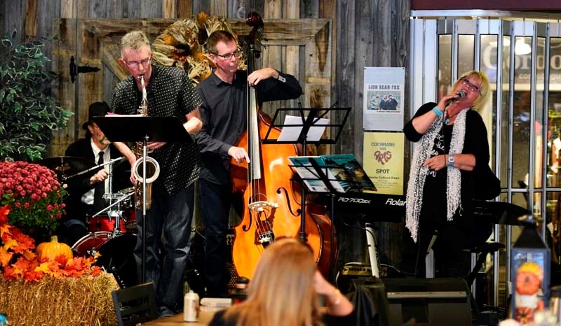 Cochrane band &#8216;Them and Her&#8217; perform at Heritage Coffee House. Cochrane was abuzz last weekend as buskers, painters and artists of all types came out of the