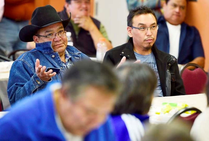 Chiniki Coun. Lional Wildman, left, tells the crowd that he didn&#8217;t know where the three chiefs were and &#8216;no other councillors wanted to show up&#8217; at a town