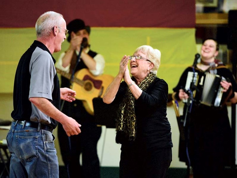 Donna Hawes and Steve Jordan dance the night away while Pete and Hosanna Justine of the Hazel Grey band perform at the Cochrane Legion&#8217;s Octoberfest celebration.