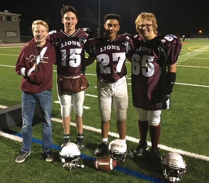 Lions&#8217; players Derek Reid, Xavier Vaillancourt, Eijah Springer and Owen Woroby.