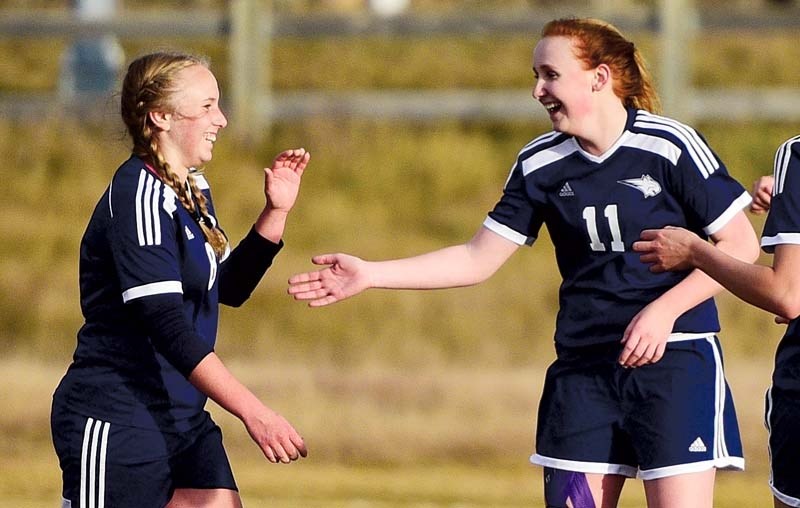 Left, Maddie Kaczur celebrates her goal with Ali Craig on October 20 as the Bobcats defeated the Cobras 2-1 at Rangers Field.