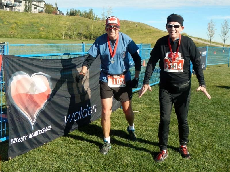 Captain Clot-Buster finishes the Heart Beat 10 km with running buddy Brian Lee.