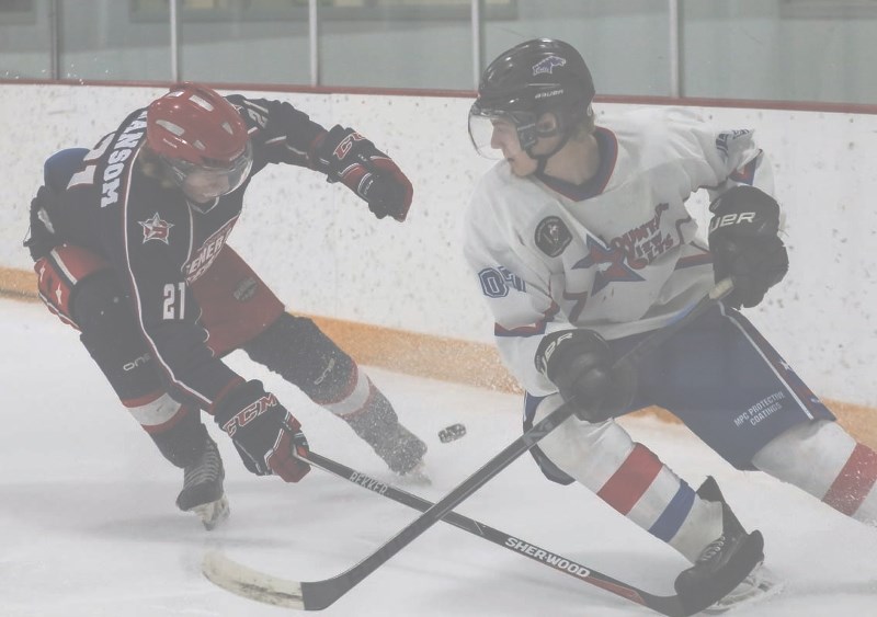 The Cochrane Generals Slater Ransom chases the puck with Mountainview Colts Corbin Houchin during game action at Spray Lakes Arenas in Cochrane.
