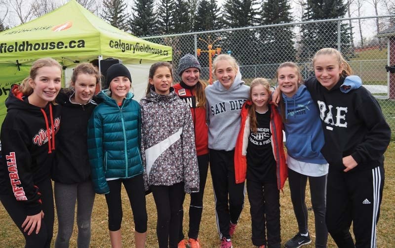 Olympian Jessica O&#8217;Connell (centre) meets with the St. Timothy High School bantam cross country team at Canmore Park in Calgary last weekend.