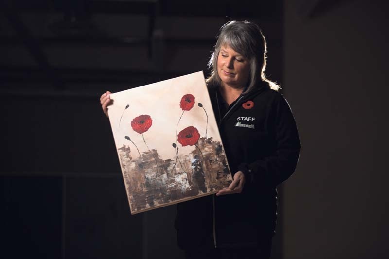 MJ Stead is auctioning her 16&#215;20 acrylic canvas called Remembering to help stock shelves at the Calgary Veteran&#8217;s Food bank. She started the bidding war at $90.