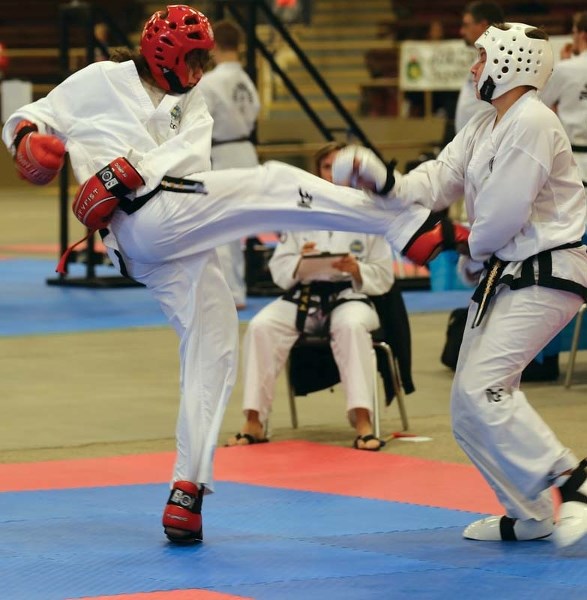 Trinity club member Jacob Mate lands a kick during sparring match at the Alberta Taekwon-do Cup 2016.