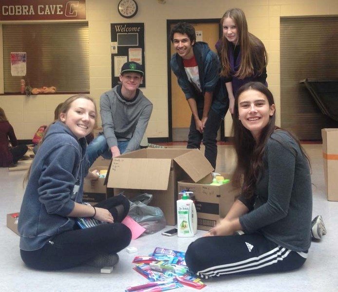 Cochrane High School students helped put together hampers for the Helping Hampers campaign.