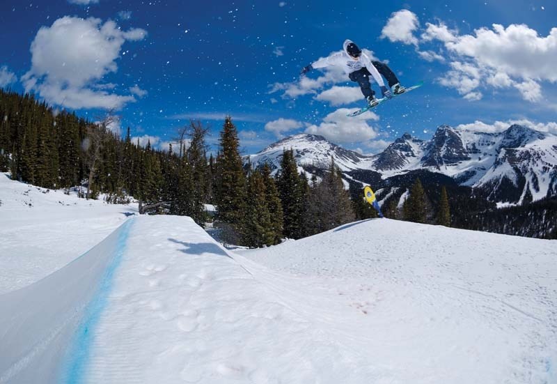 Snowboarder Finn Westbury slides down a rail in Calgary.