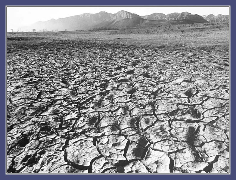 Wide-angle view of mountains west of Morley across hostile foreground beckons viewers to see beyond immediate despair to find hope.