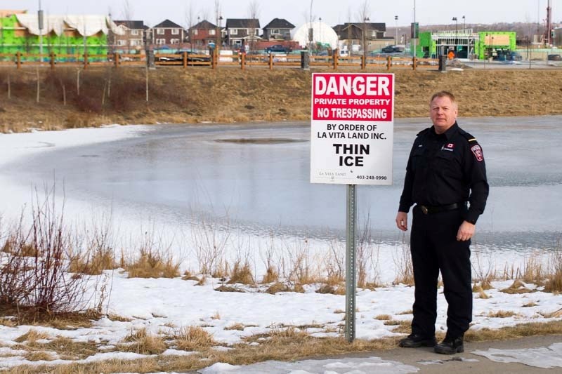 Jeff Avery with the fire department warns people about thin ice.
