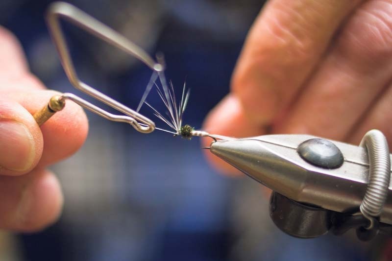 The Cochrane Fly Tying Club meets once a week to create intricate, realistic artificial insects.