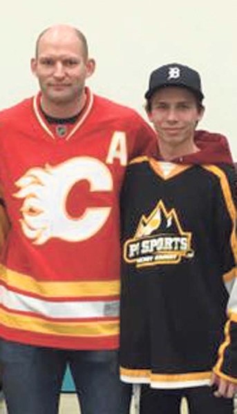 Hockey player Dace Carlson inspired students at Manachaban Middle School with his speech about teamwork on Feb. 10.