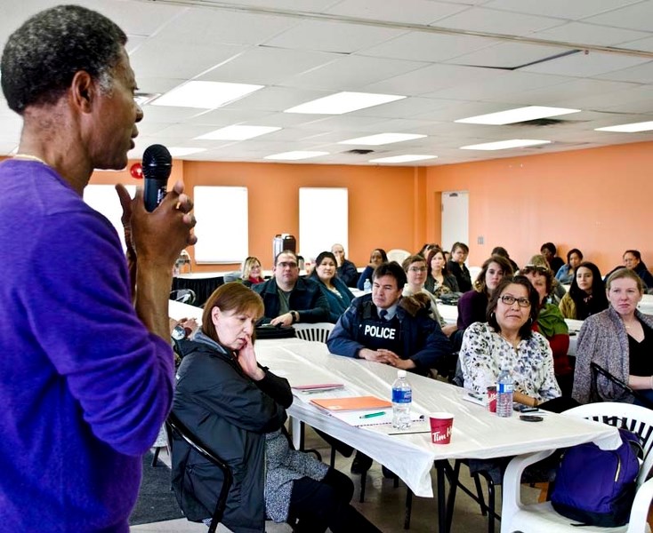 Hopeton Louden (left) the CEO for Wesley First Nation speaks to a group of Stoney Nakoda First Nation residents and community members at the second meeting hosted at the