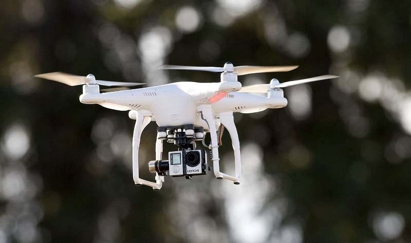 A Phantom 2 drone piloted by Chris Anderson of UAV North Aerials takes off just south of Big Lake to survey a 40-acre site. The drone is equipped with a small camera with
