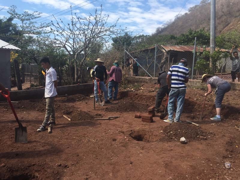 Rotarians helpes people is El Salvador replace dilapitated housing.