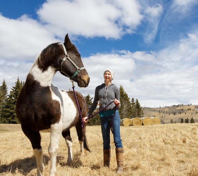 Lilly Morris, a mentor, takes Oreo for a walk outside of the Spirit Winds Ranch on April 8. The Spirit Winds Ranch is a place for children to come and experience horse