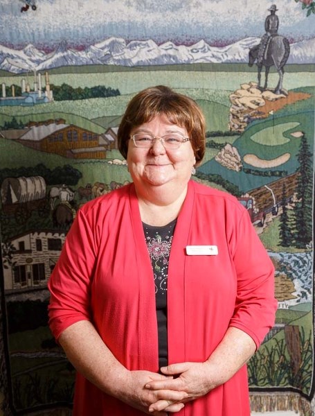 Susan Flowers poses for a portrait insider her office in the Cochrane Family &#038; Community Support Services on April 10.