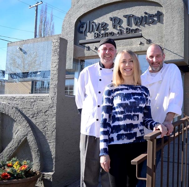 Cory Mysyk, left, Megan and Vince Houde pose in front of their restaurant, Olive &#8216;R Twist Bistro and Bar. The trio are closing the doors of the 10-year-old