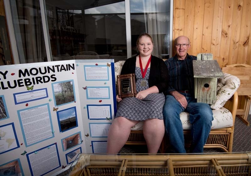 Jessica Tinholt, 18, and her grandfather Darrel Bender in Cochrane on Tuesday, April 25, 2017. Tinholt began building bird boxes with her grandfather when she was younger and 