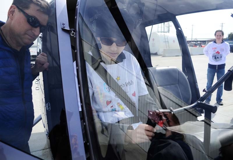 Tristan Garrett (wearing a black hat), 14, from Calgary had his Children&#8217;s Wish granted last Thursday thanks to the Kimmett Foundation. Garrett was able to fly with