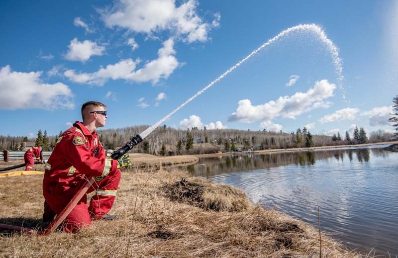 Jesse Lawrence of the Redwood Fire Department during a joint training exercise in Bragg Creek on Saturday, April 29