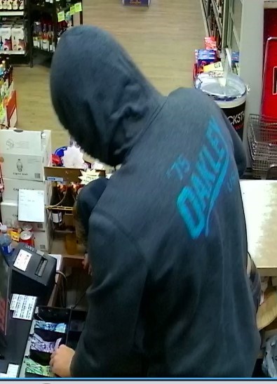 A photo captured of the robbery at Fourth Ave on May 10 between 11:30 p.m. and 12:30 a.m. The suspect is described as a Caucasian male, over 6 ft, wearing hoody and dark