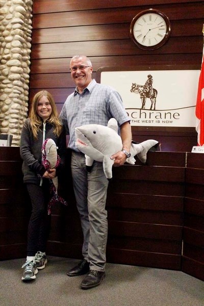 Mayor Ivan Brooker poses with Belle Levisky, who prompted the town to issue a ban on shark fin soup.