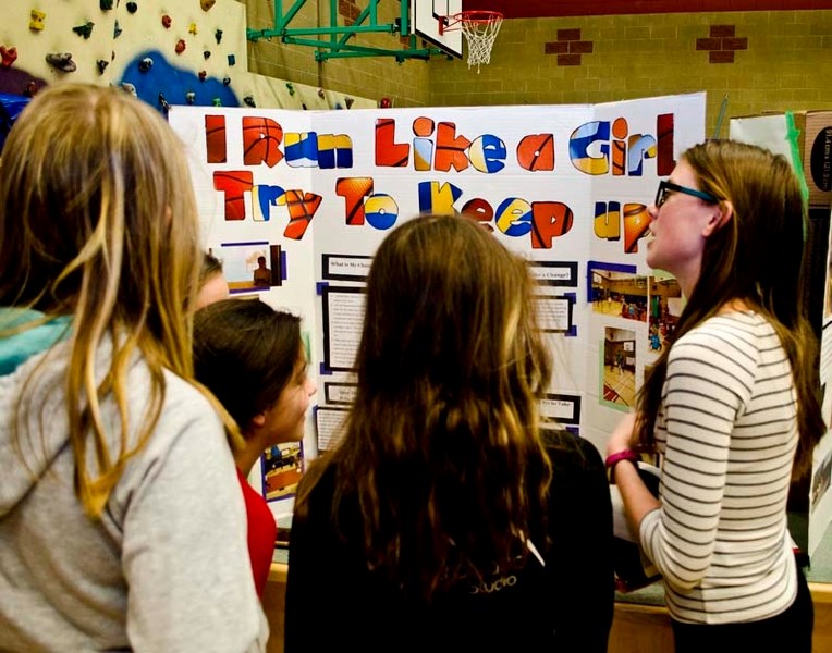 Banded Peak student Ahneke (right) showcases her &#8216;I run like a girl try keep up&#8217; project at the annual Change Expo at the Bragg Creek school on May 5.