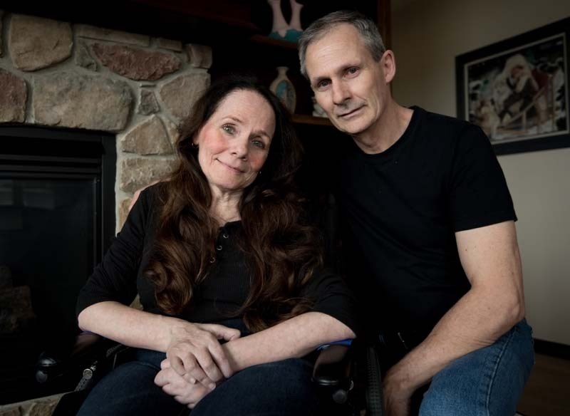 Nancy Doyle, who has Lyme disease, with her husband, John, in their Cochrane home.