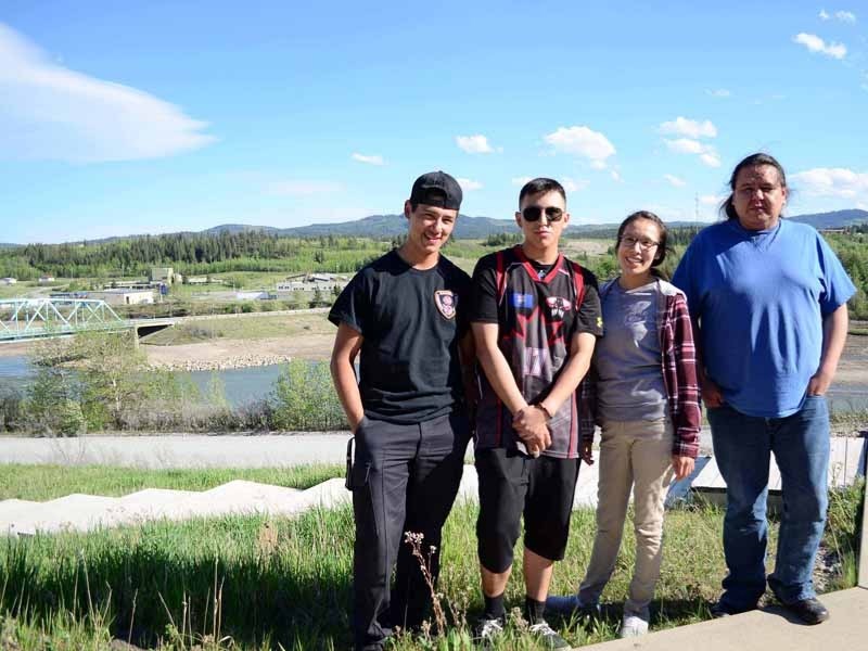 Four out of the seven members of the Nakoda Youth Council Lonnie Dixon, Gage Beaver, Candace Alexander and Joey Makinawlabelle stand at the Stoney Nakoda Resource centre