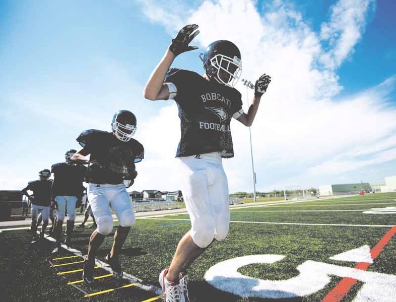 Brett Johnston participates in spring football camp at Bow Valley High School in Cochrane on Tuesday, May 30, 2017.