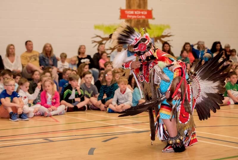 Hardy Smalleyes, 10, of Stoney Nakoda First Nation performed a traditional men&#8217;s dance for students, teachers and parents at Glen Bow Elementary School in Cochrane on