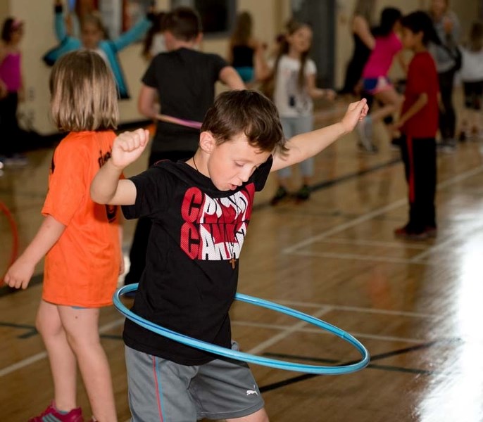 Holy Spirit School Grade 2 student Liam Hurley hula hoops during their Health Fair at the Spray Lake Sawmills Family Sports Centre in Cochrane on Friday, June 9, 2017.