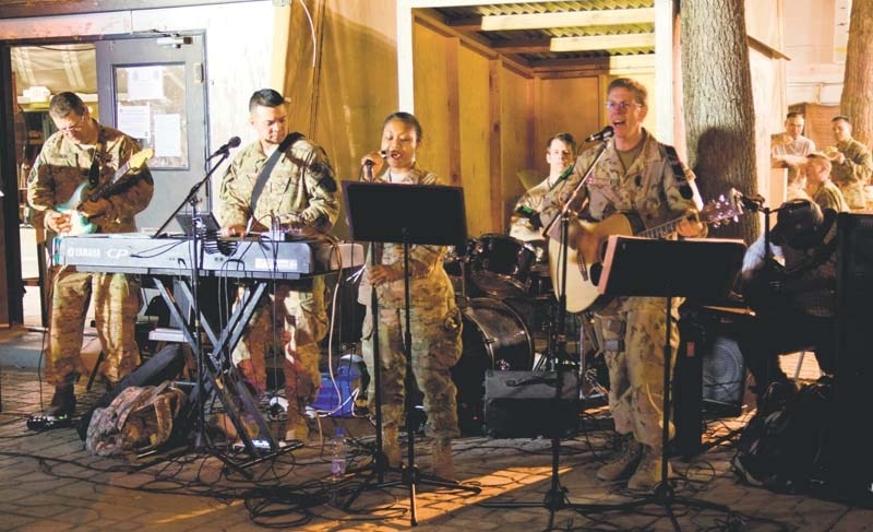 Tim Isberg (right) performs at Camp Eggers in Kabul, Afghanistan, with one of the many iterations of The Band with No Name.