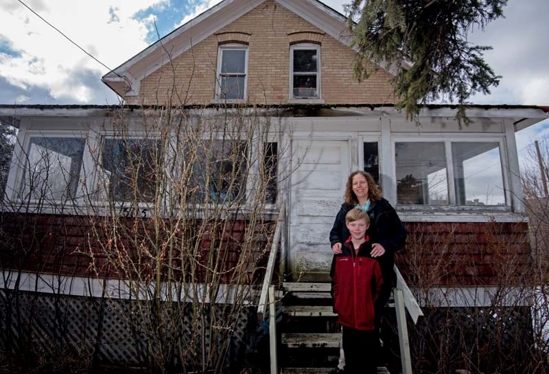 Michelle Copithorne with her son Alexander Adrian,9, in her newly bought 1911- built home in Cochrane on Tuesday, April 25, 2017. Copithorne and her husband will be restoring 