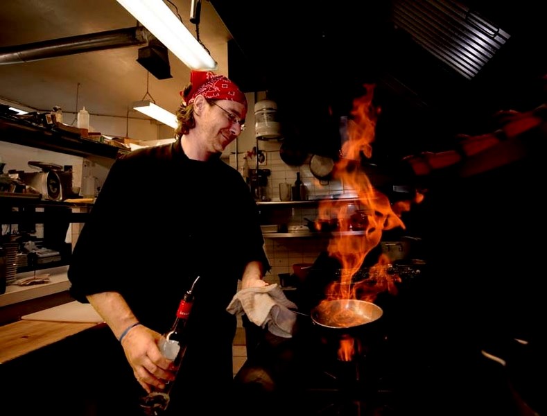 Portofino Restaurant chef Robert Langlois increases the heat in the kitchen in Cochrane on Friday, June 16, 2017. The local restaurant was voted most romantic restaurant and