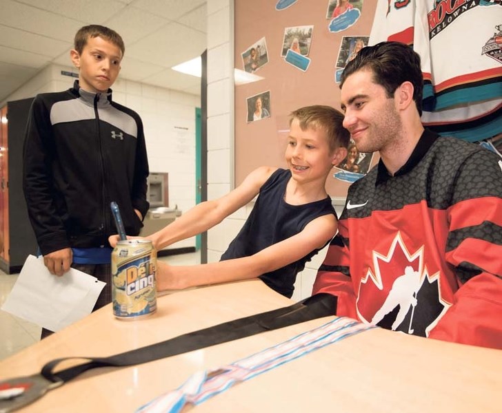 Matthew Chambers takes a “;selfie”with Dillon Dube.