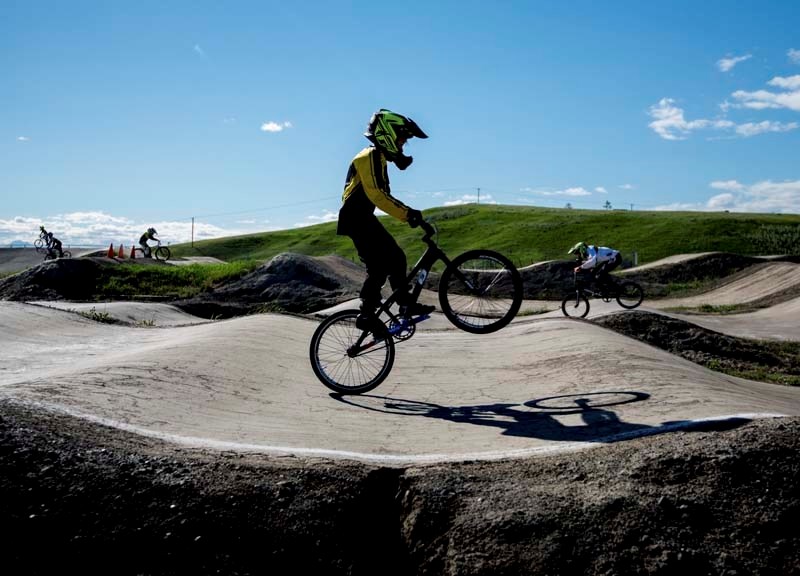A competitor practices his skills before the Friday Night Lights Race 1 competition at the BMX track in Cochrane on Friday, June 9, 2017.