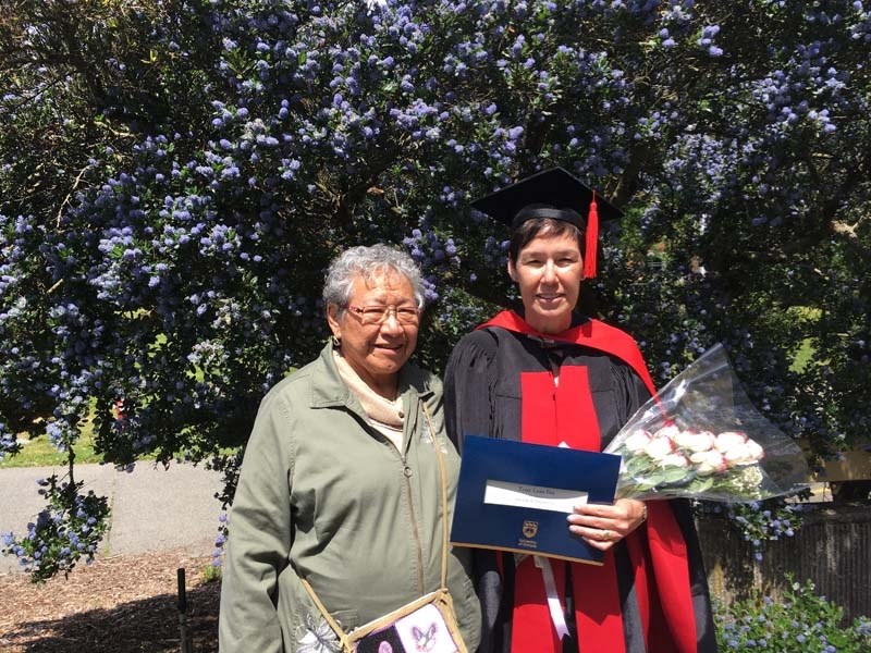 Terry Fox stands with proud mother Tina Fox (left) after she received her PhD from the University of Victoria earlier this year.