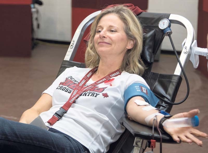 Assitant Principal Tracy Lyons donates blood for the first time while at Cochrane High School on Nov. 4, 2016.