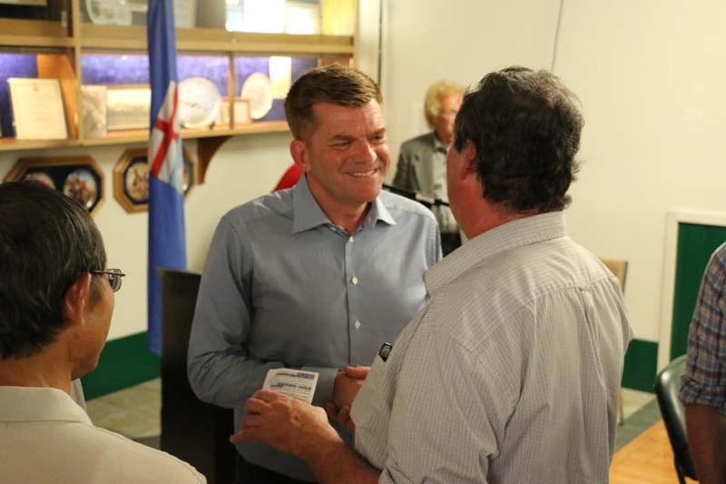 Wildrose Party leader Brian Jean meets Cochranites at a unity event on Monday.