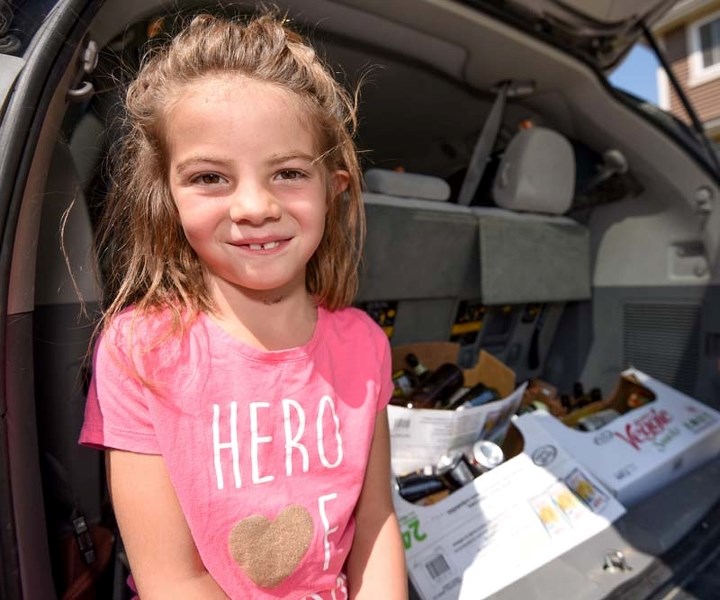 Kiara Wiltshire, 7, poses for a portrait at her home in Cochrane on Tuesday, July 18, 2017. Wiltshire has currently raised $280 through bottle collection for BC Wildfire