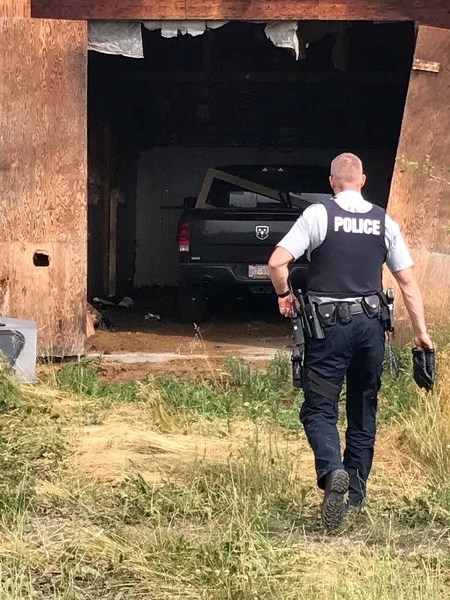 Cochrane RCMP recovering one of the stolen vehicles from southern Alberta in an abandon property in Morley on July 9.